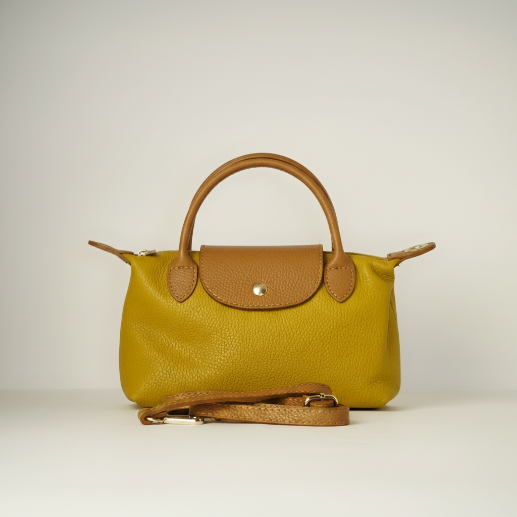 Bolso de mano de cuero amarillo mostaza con detalles marrones