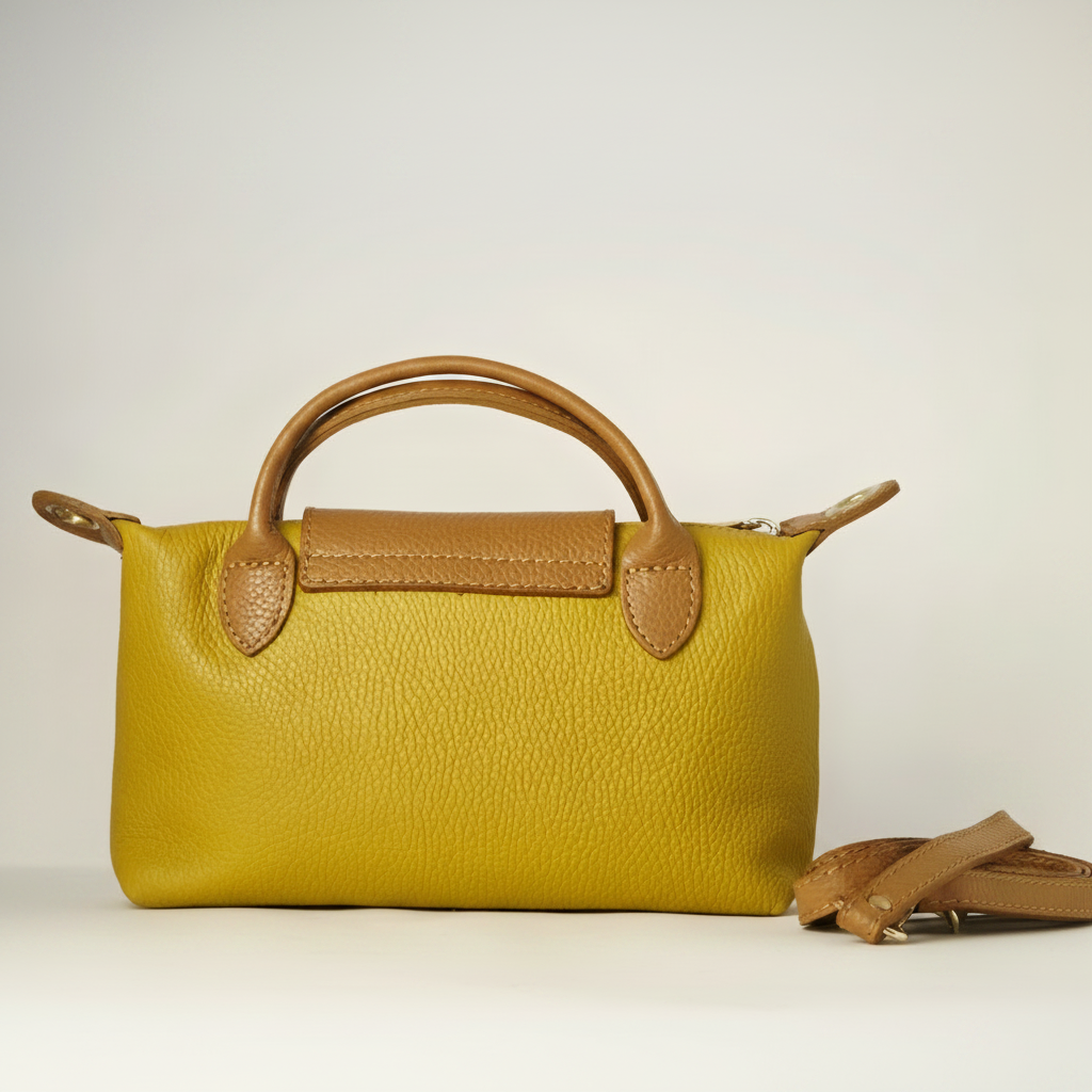 Bolso de mano de cuero amarillo mostaza con detalles marrones