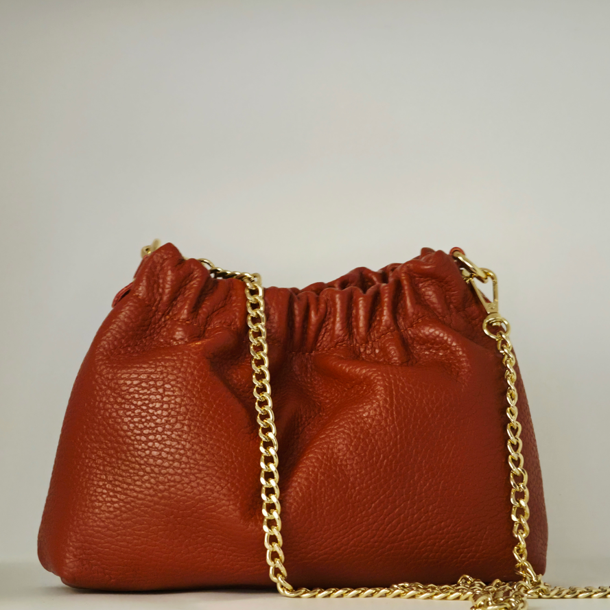 Bolso mini saco en piel color teja