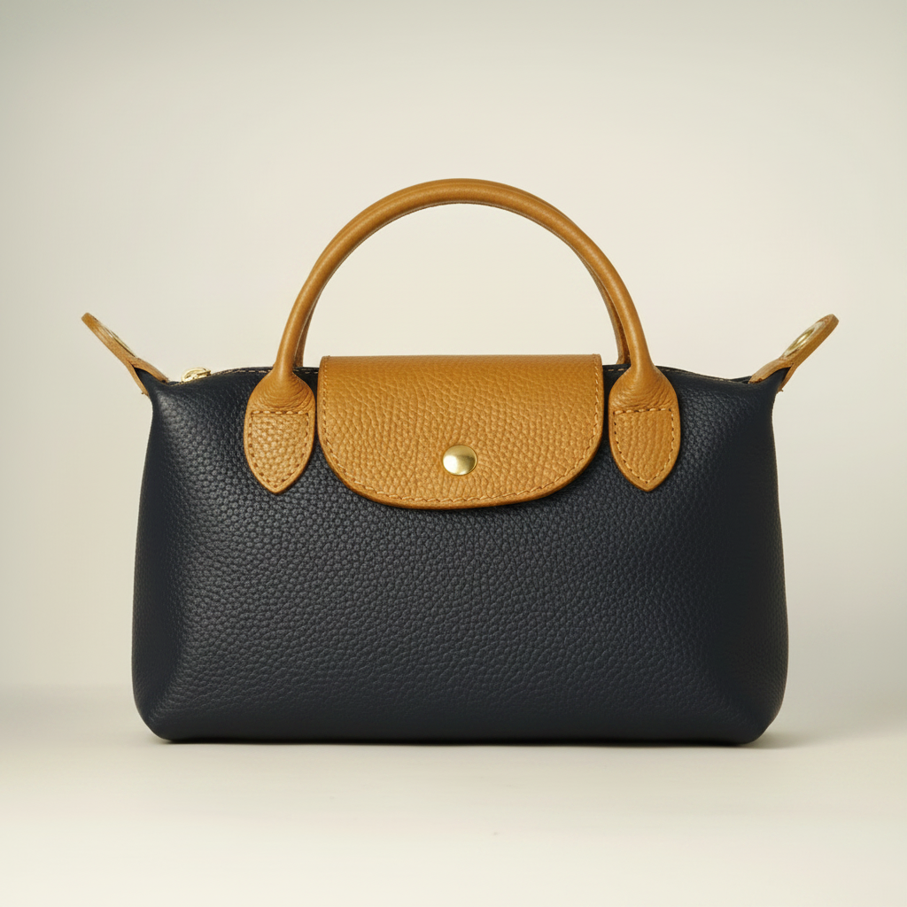 Bolso de mano de cuero azul marino con detalles marrones