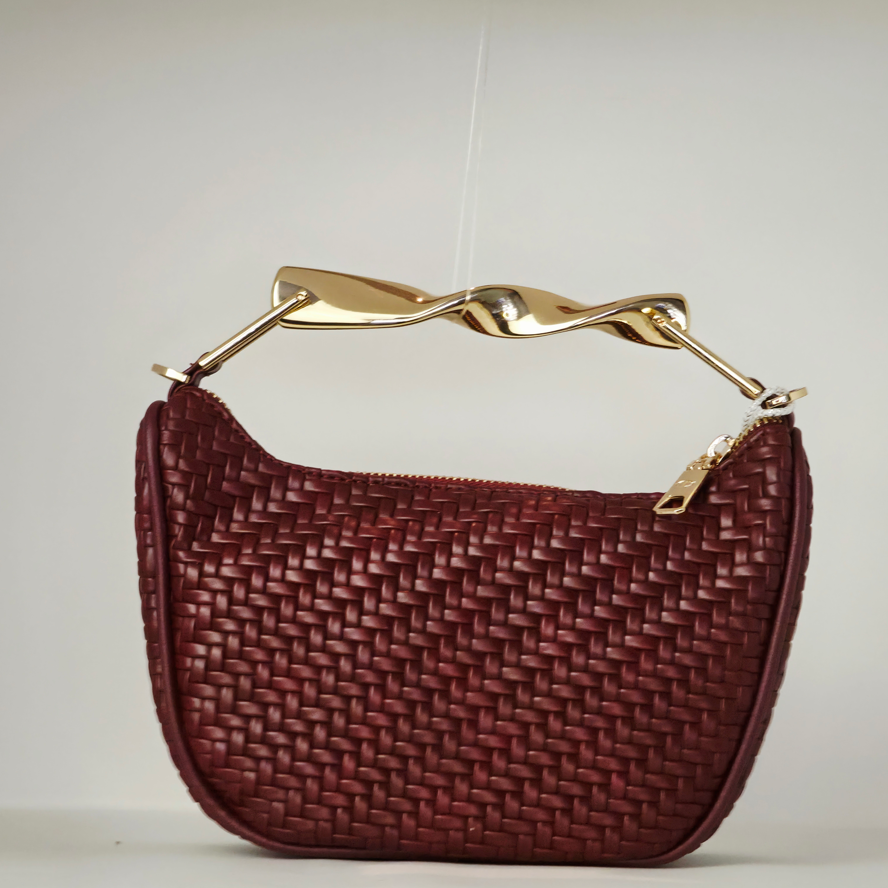 Bolso de mano con efecto piel trenzada en material sintético