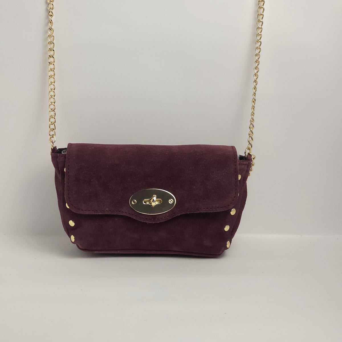 Mini bolso en piel de ante color vino