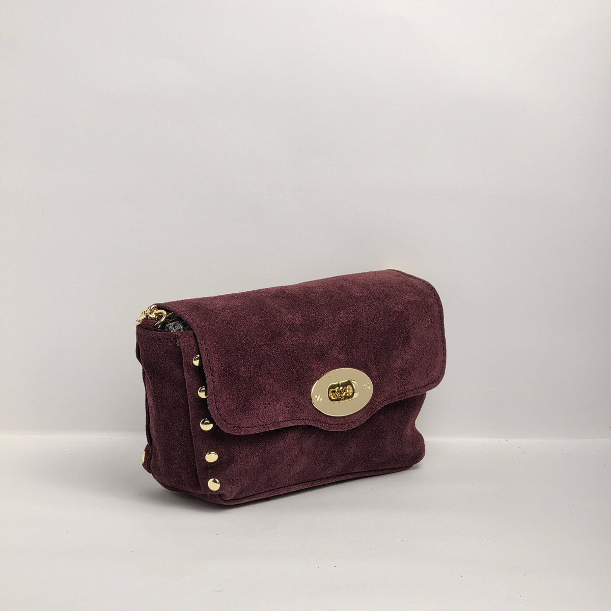 Mini bolso en piel de ante color vino