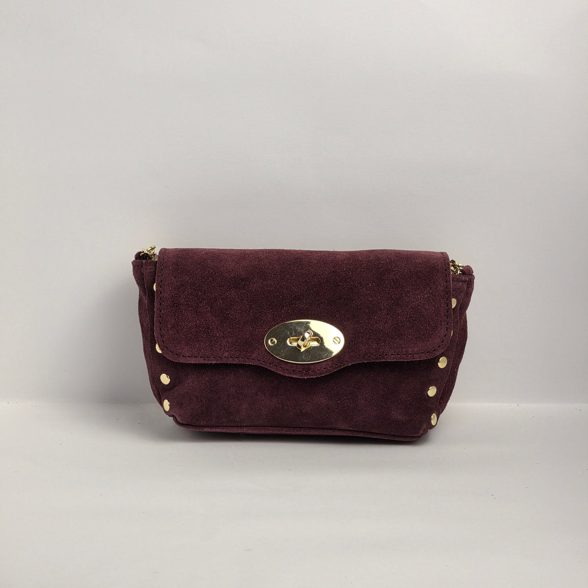Mini bolso en piel de ante color vino