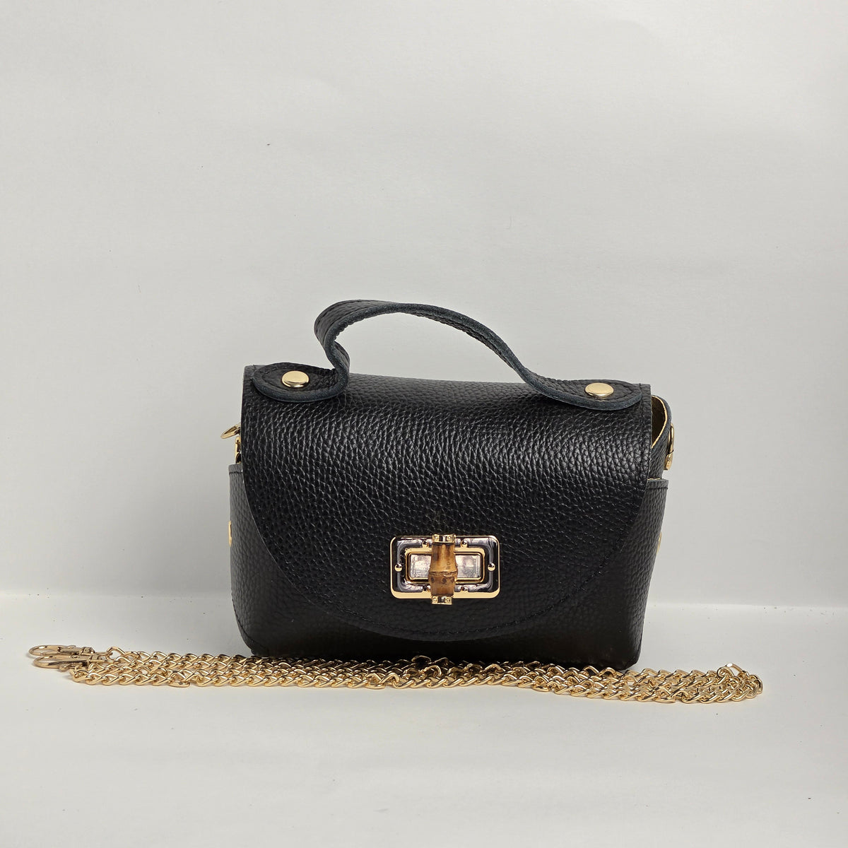 Mini bolso de mano en piel negra