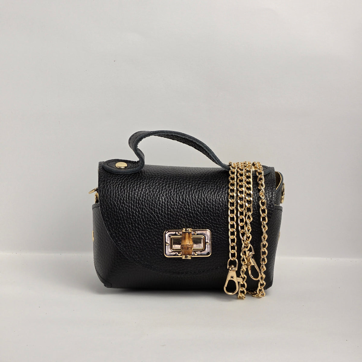Mini bolso de mano en piel negra