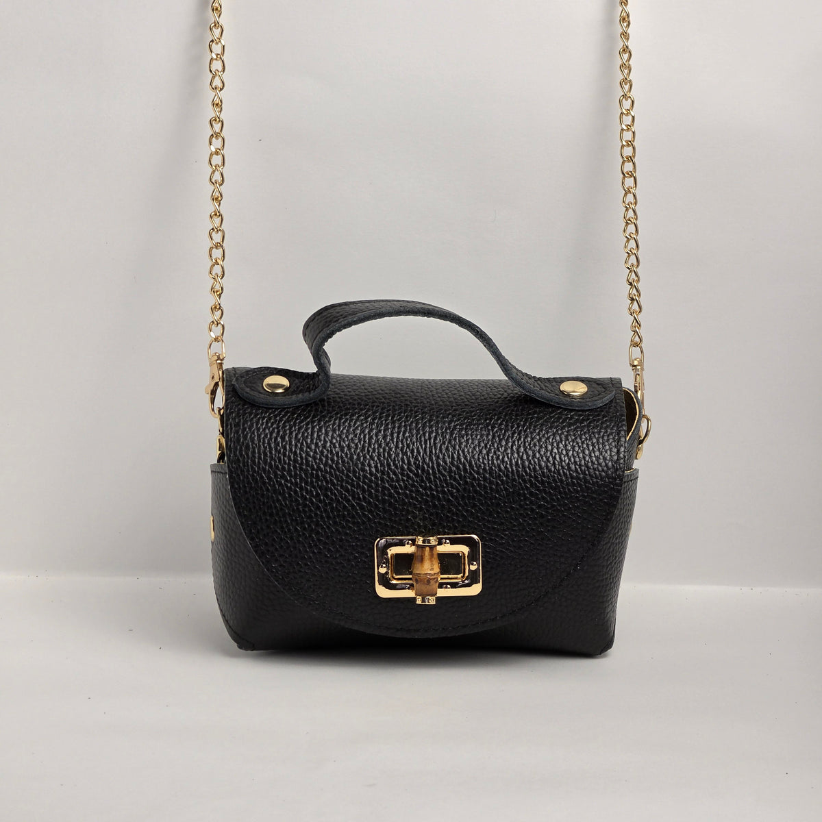 Mini bolso de mano en piel negra