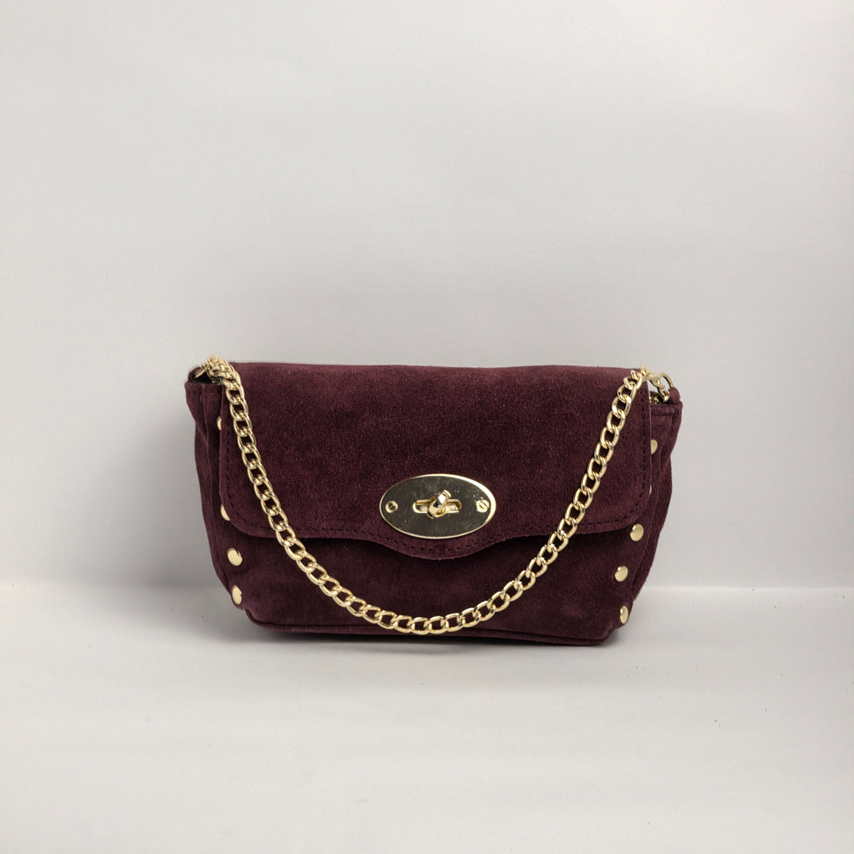 Mini bolso en piel de ante color vino