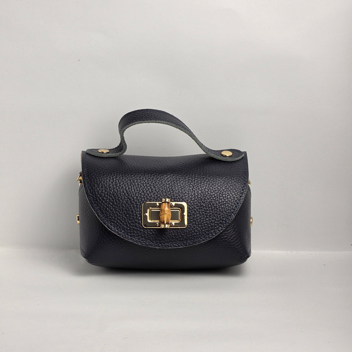 Mini bolso de mano en piel azul marino