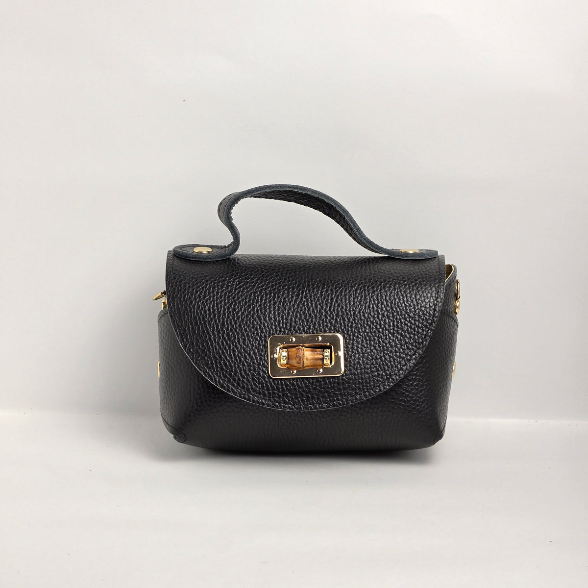 Mini bolso de mano en piel negra