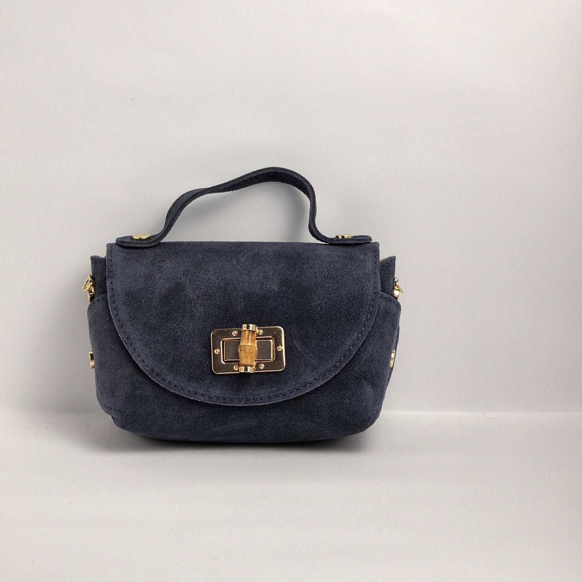 Mini bolso de mano en piel de ante azul marino