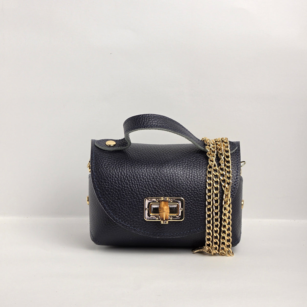 Mini bolso de mano en piel azul marino