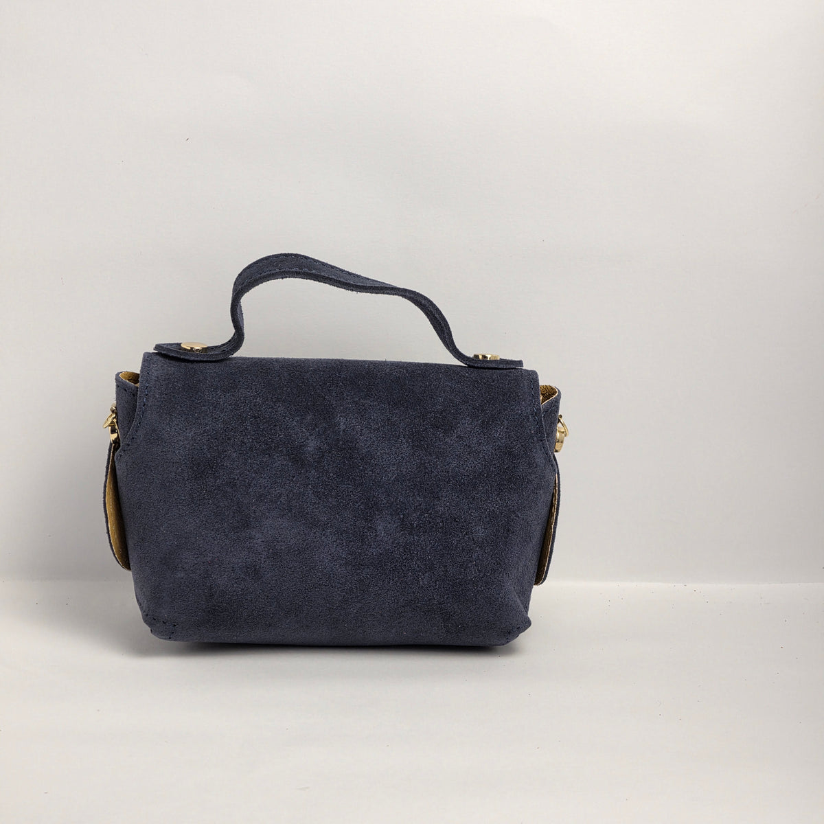Mini bolso de mano en piel de ante azul marino